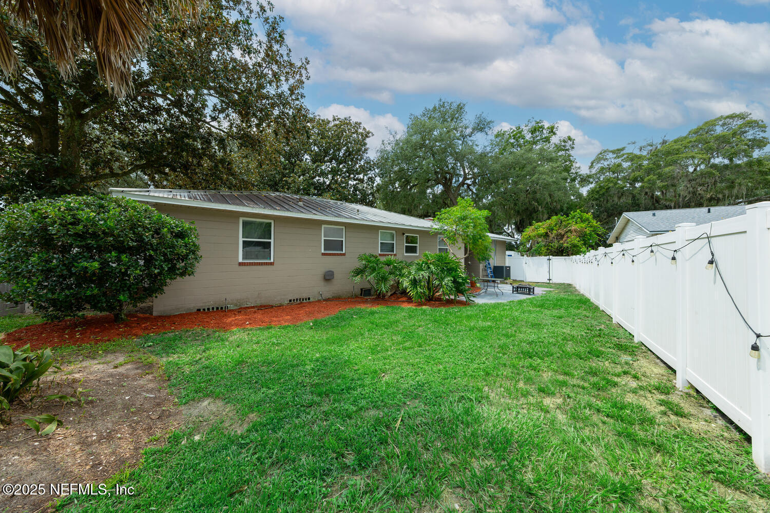 8309 Calento Street Jacksonville, FL 32211 - Photo 21 of 22 a view of backyard with garden and plants