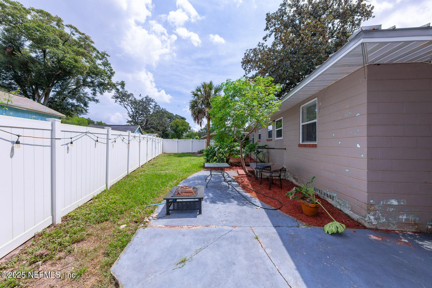 8309 Calento Street Jacksonville, FL 32211 - Photo 24 of 25 a backyard of a house with wooden floor