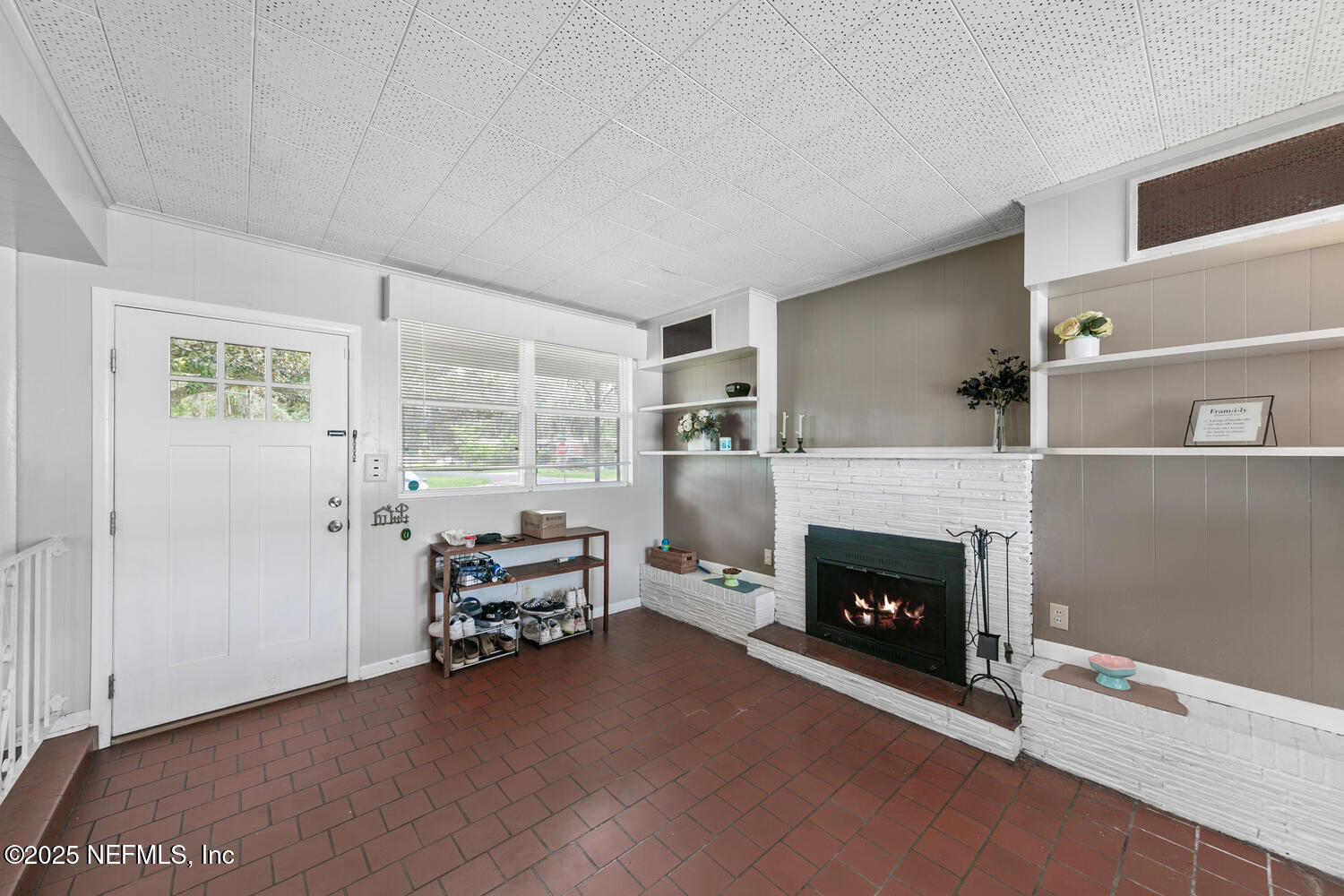 8309 Calento Street Jacksonville, FL 32211 - Photo 4 of 22 a living room with furniture and a fireplace