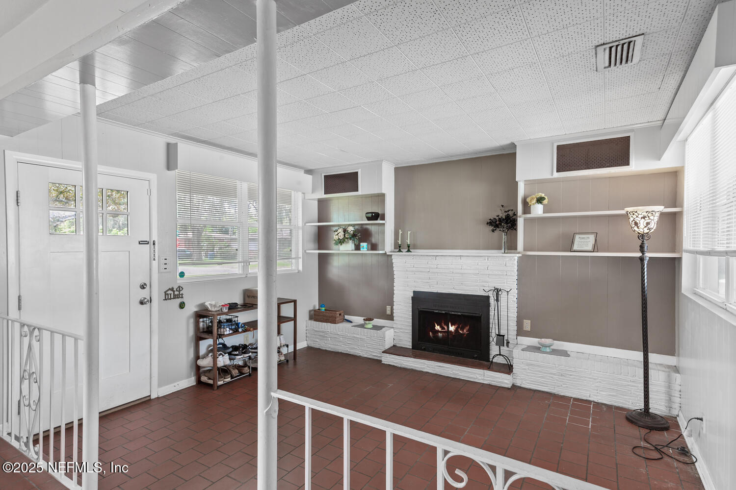 8309 Calento Street Jacksonville, FL 32211 - Photo 5 of 22 a living room with furniture and a fireplace