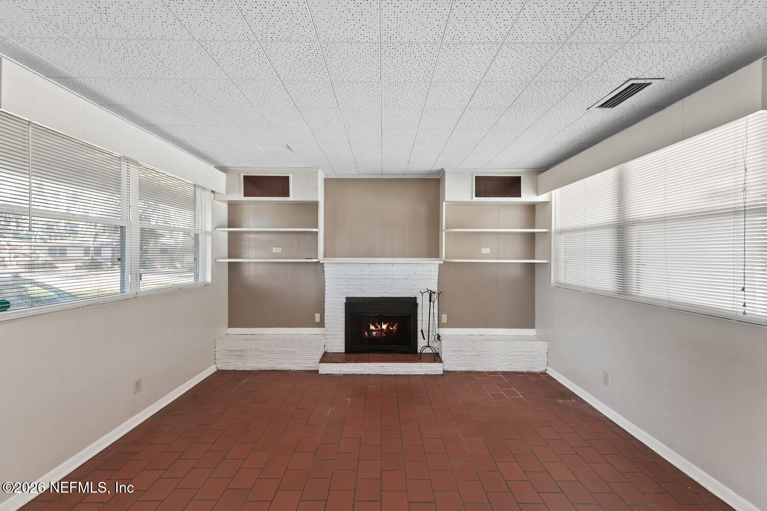 8309 Calento Street Jacksonville, FL 32211 - Photo 6 of 25 a living room with furniture and a fireplace