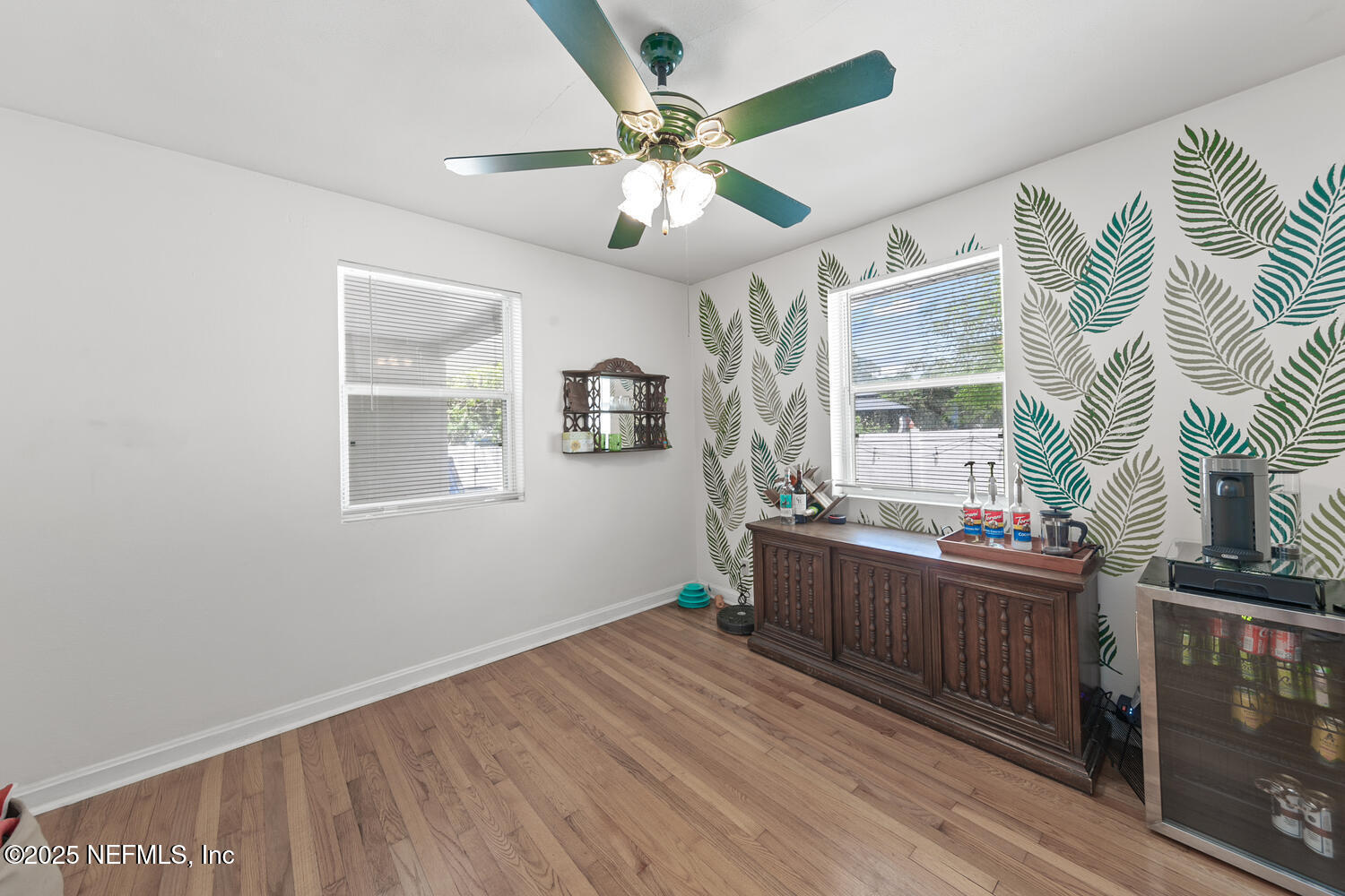 8309 Calento Street Jacksonville, FL 32211 - Photo 9 of 22 wooden floor in an empty room with a window