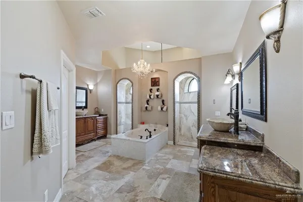 a living room with furniture and large mirror
