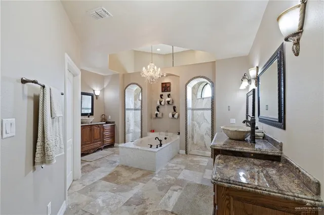 a living room with furniture and large mirror