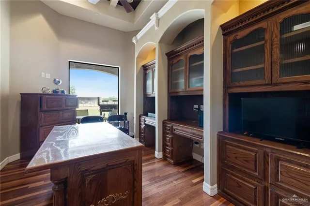 a living room with furniture and flat screen tv
