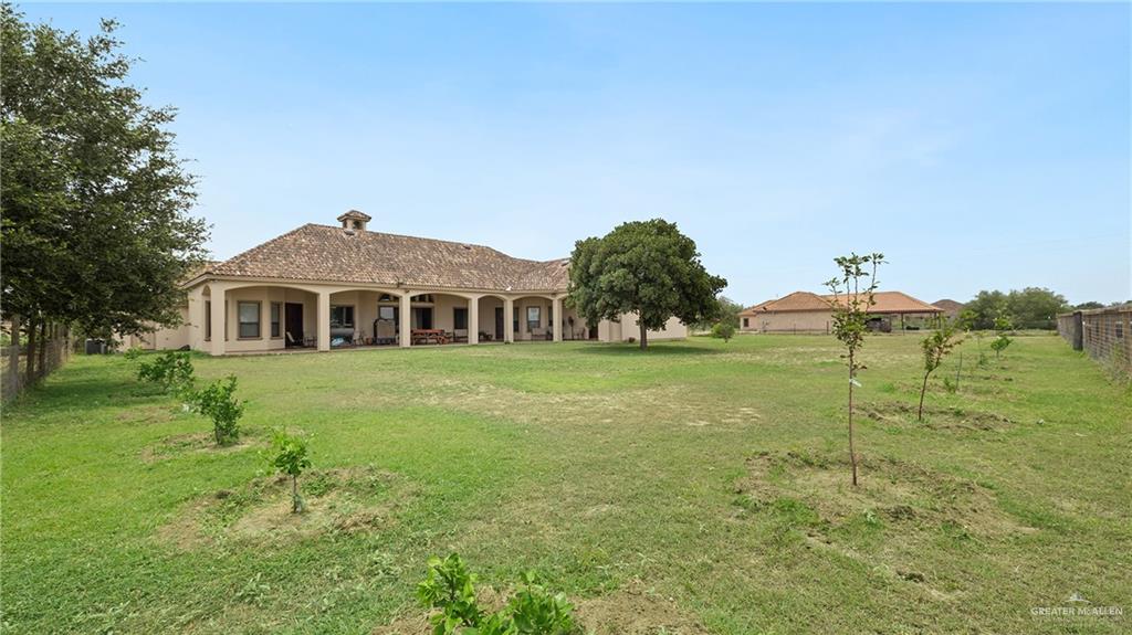 22209 Uresti Road Edinburg, TX 78542 - Photo 31 of 38 a front view of a house with a yard