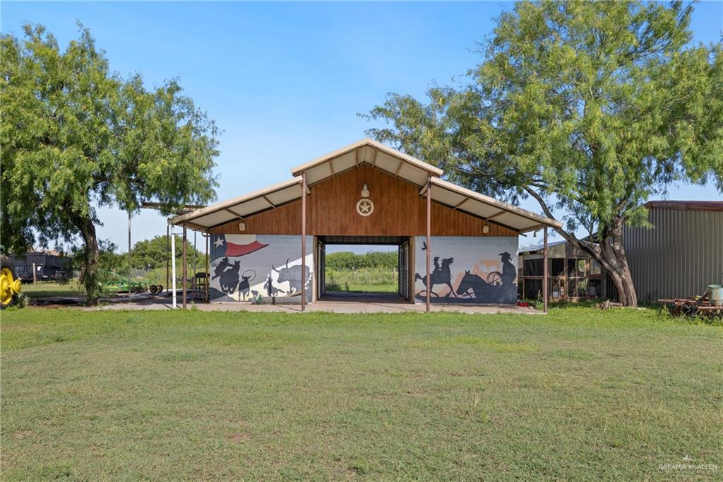 22209 Uresti Road Edinburg, TX 78542 - Photo 32 of 38 a front view of a house with a yard