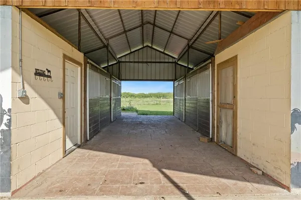 a view of a garage with a white car parked