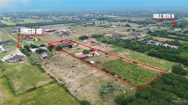 an aerial view of beach and yard