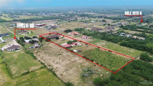 an aerial view of beach and yard