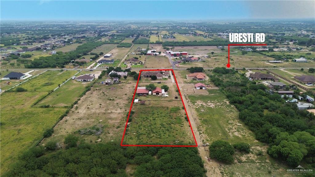 22209 Uresti Road Edinburg, TX 78542 - Photo 38 of 38 an aerial view of residential houses with outdoor space and trees