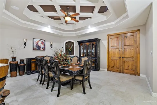 a view of a dining room with furniture and chandelier