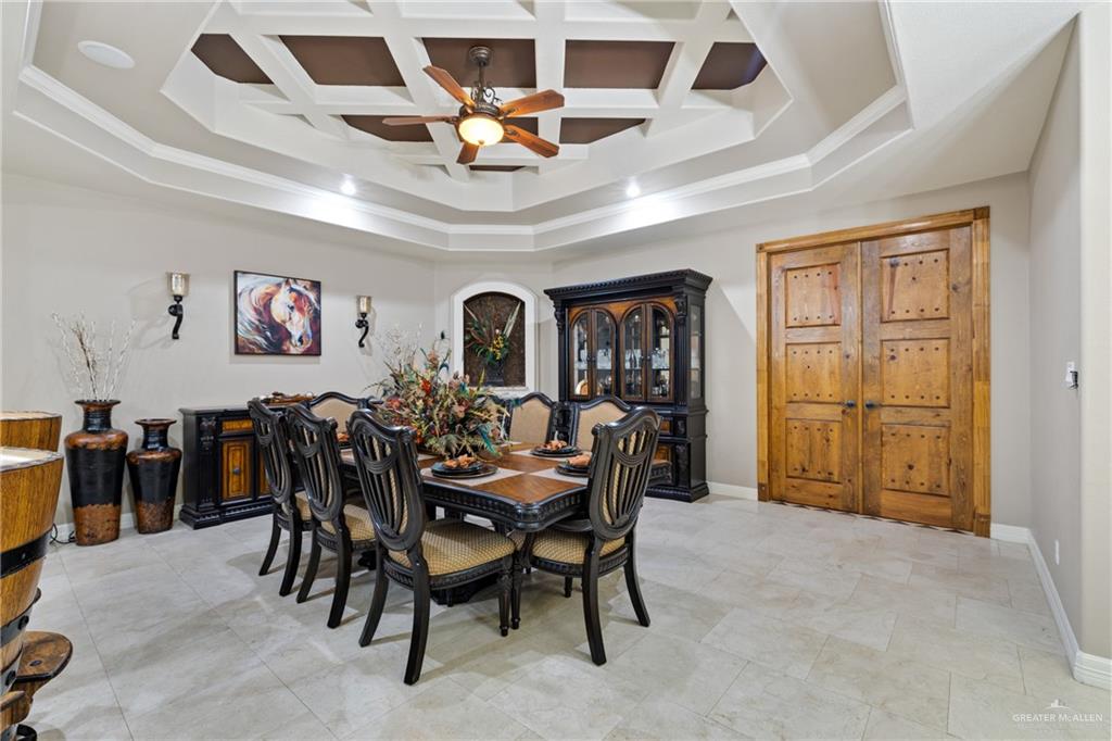 22209 Uresti Road Edinburg, TX 78542 - Photo 9 of 38 a view of a dining room with furniture and chandelier