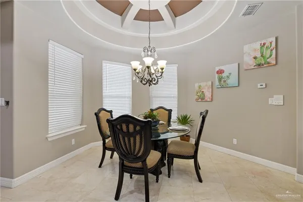 a dining room with furniture and window