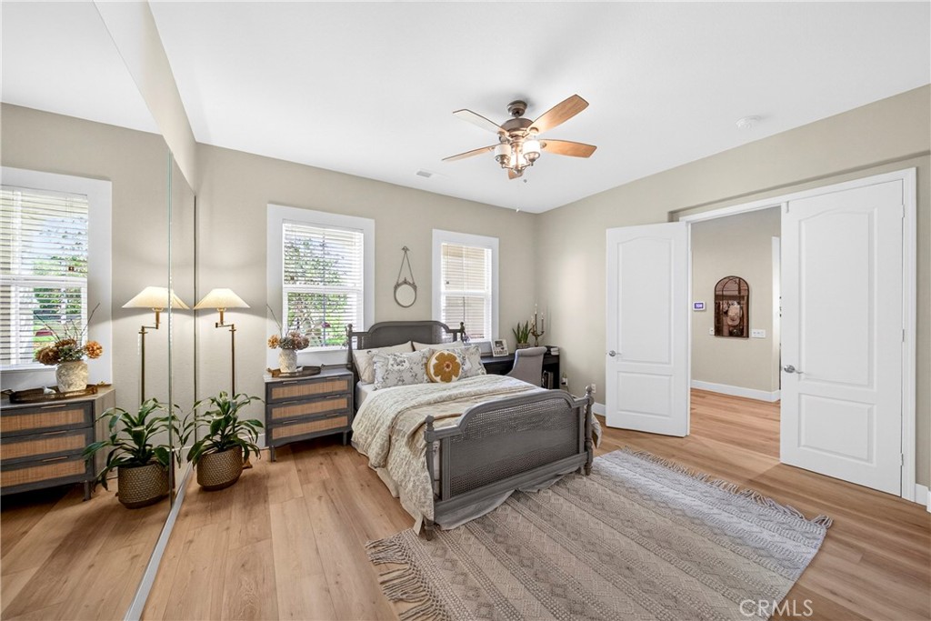 16375 Ory Circle Riverside, CA 92503 - Photo 45 of 51 a bed room with a bed and a chandelier