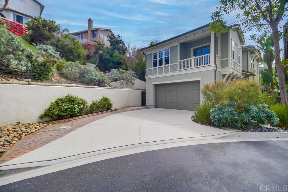 501 Beach Street Encinitas, CA 92024 - Photo 16 of 16 a front view of a house with a yard and a garage