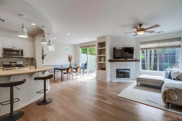 a living room with furniture fireplace and a flat screen tv