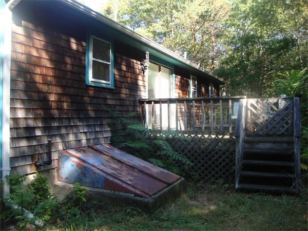 118 High Street Rochester, MA 02770 - Photo 11 of 13 a backyard of a house with lots of green space