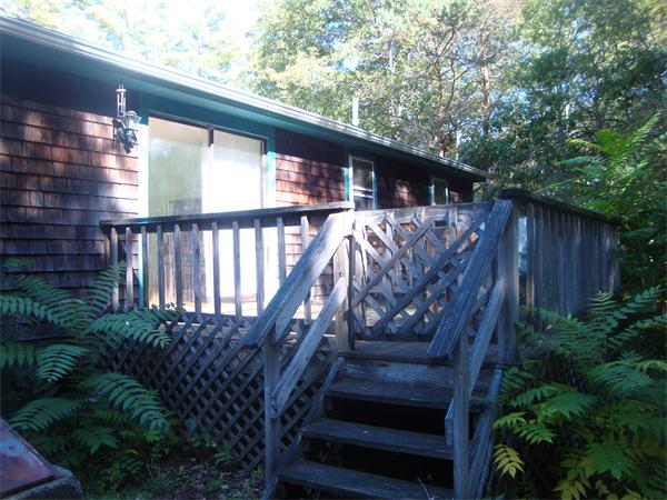 118 High Street Rochester, MA 02770 - Photo 12 of 13 a view of a house with backyard and wooden deck