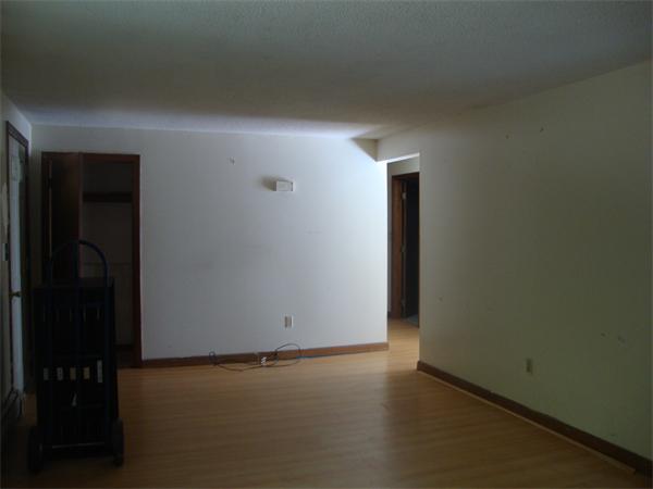 118 High Street Rochester, MA 02770 - Photo 5 of 13 an empty room with wooden floor and closet