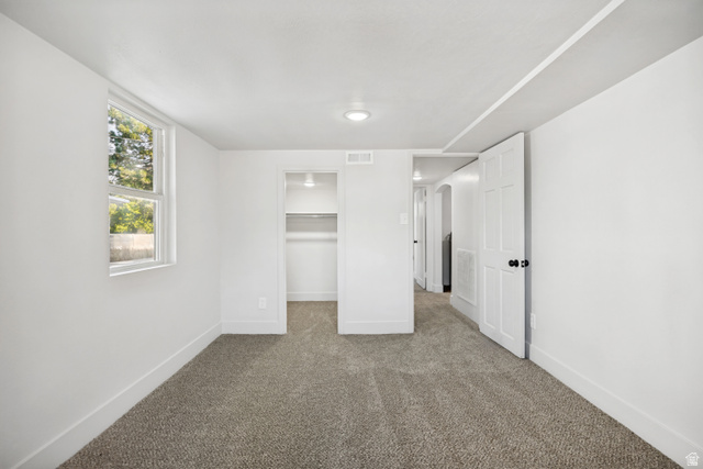 662 29th Street Ogden, UT 84403 - Photo 17 of 23 Carpeted room featuring a double-hung window, recessed lighting, and a built-in closet with shelving