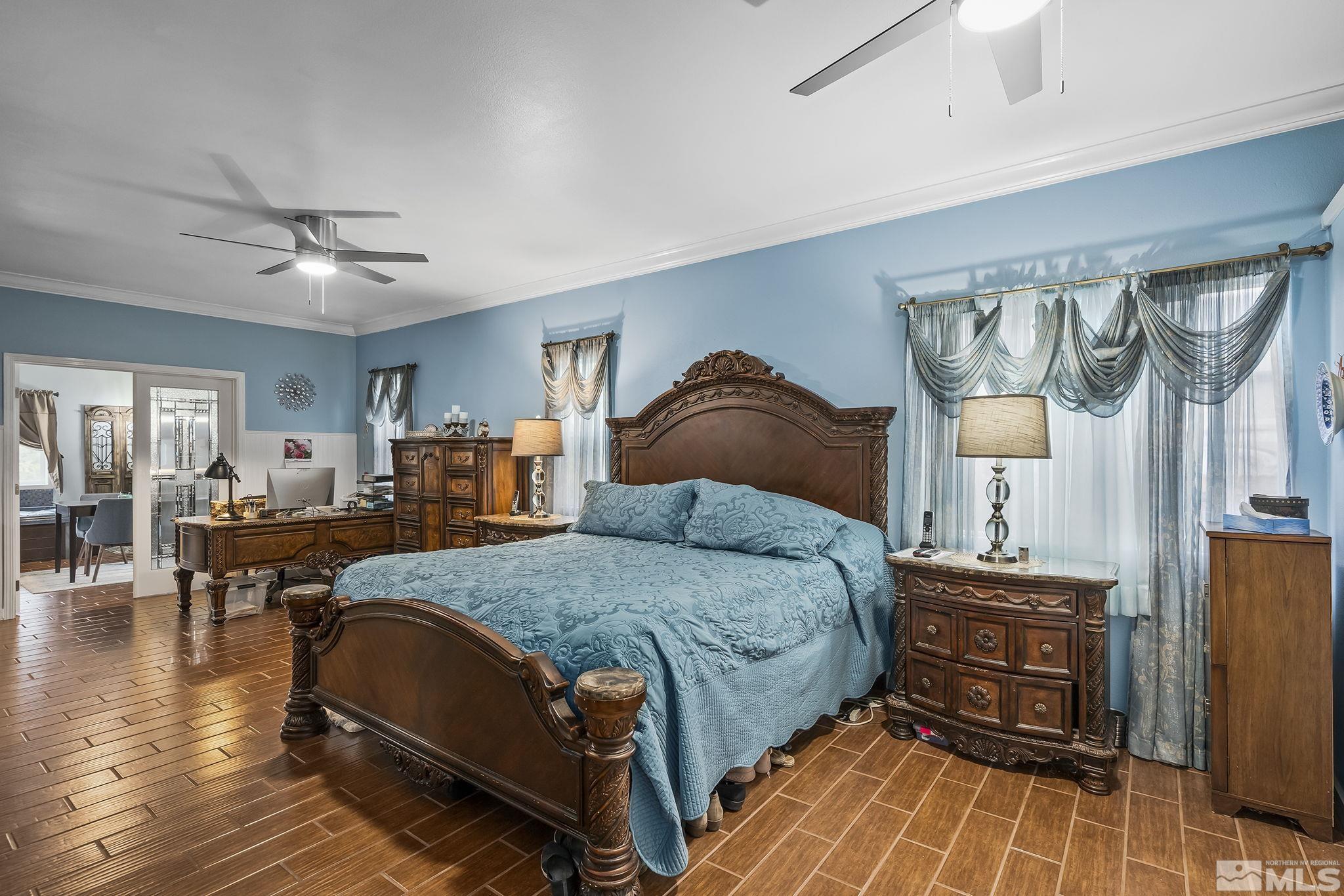 7615 Crest Bluff Drive Reno, NV 89506 - Photo 11 of 32 a bedroom with a bed and wooden floor