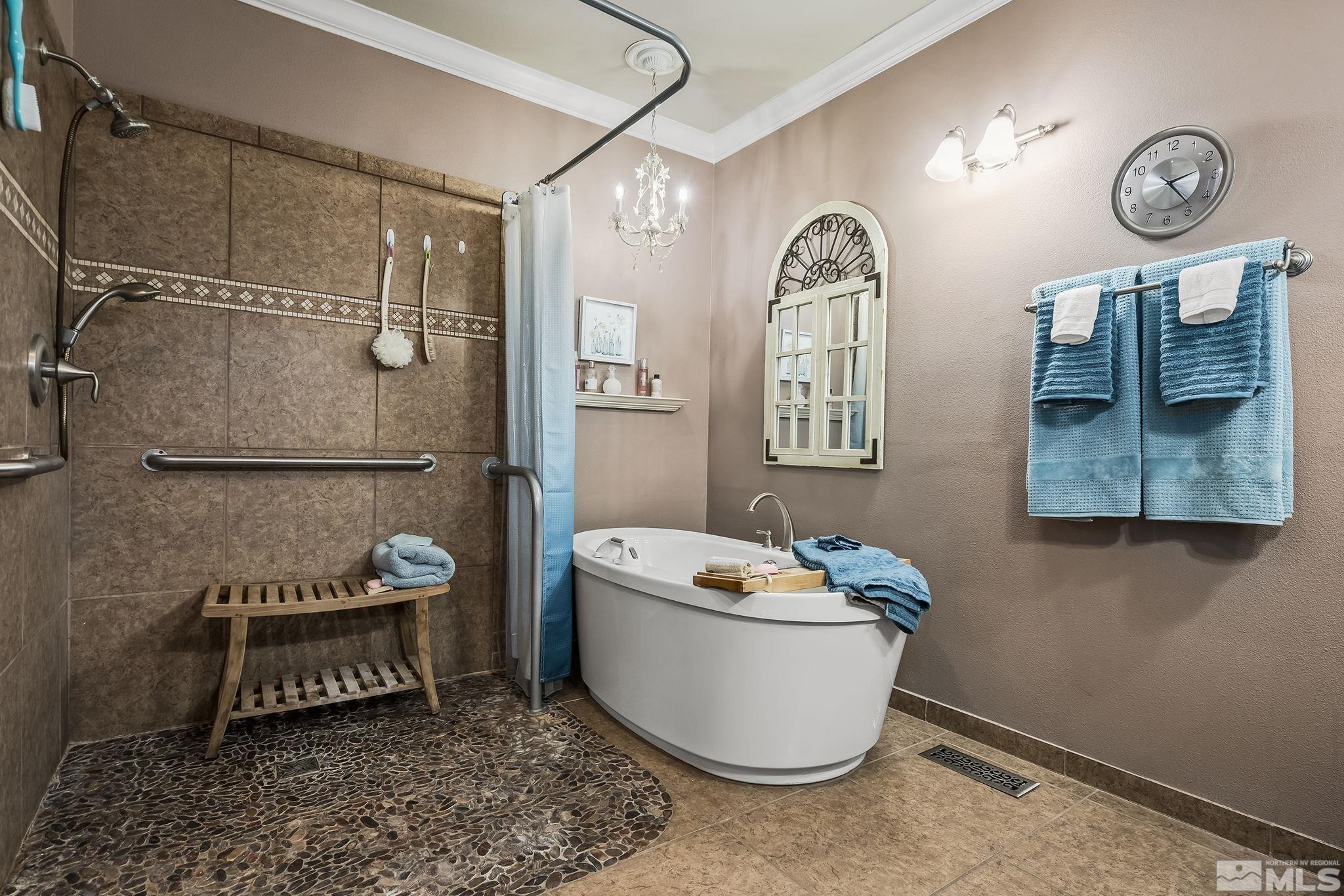 7615 Crest Bluff Drive Reno, NV 89506 - Photo 13 of 32 a bathroom with a toilet a sink and mirror