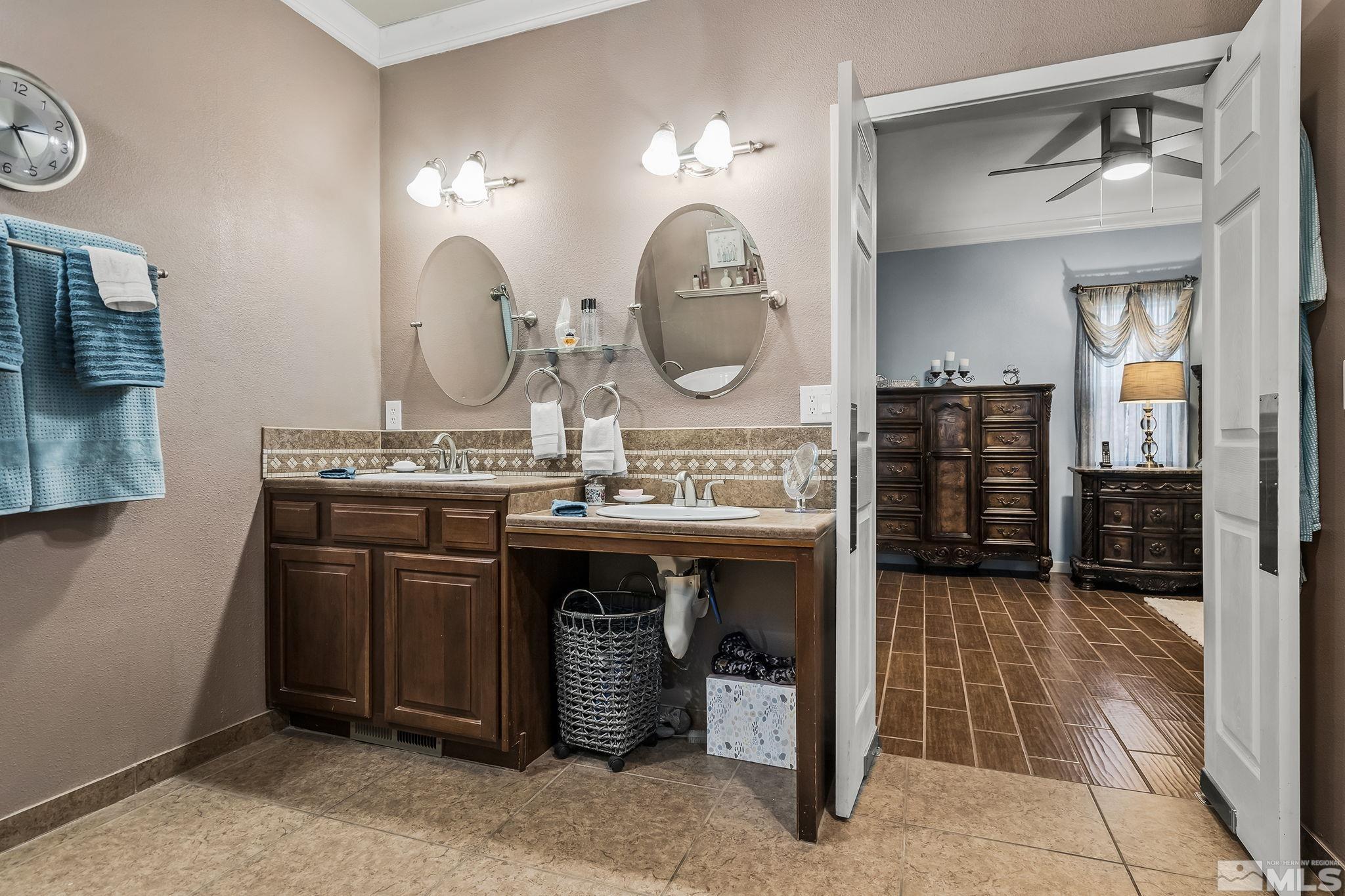 7615 Crest Bluff Drive Reno, NV 89506 - Photo 14 of 32 a bathroom with a sink and a mirror