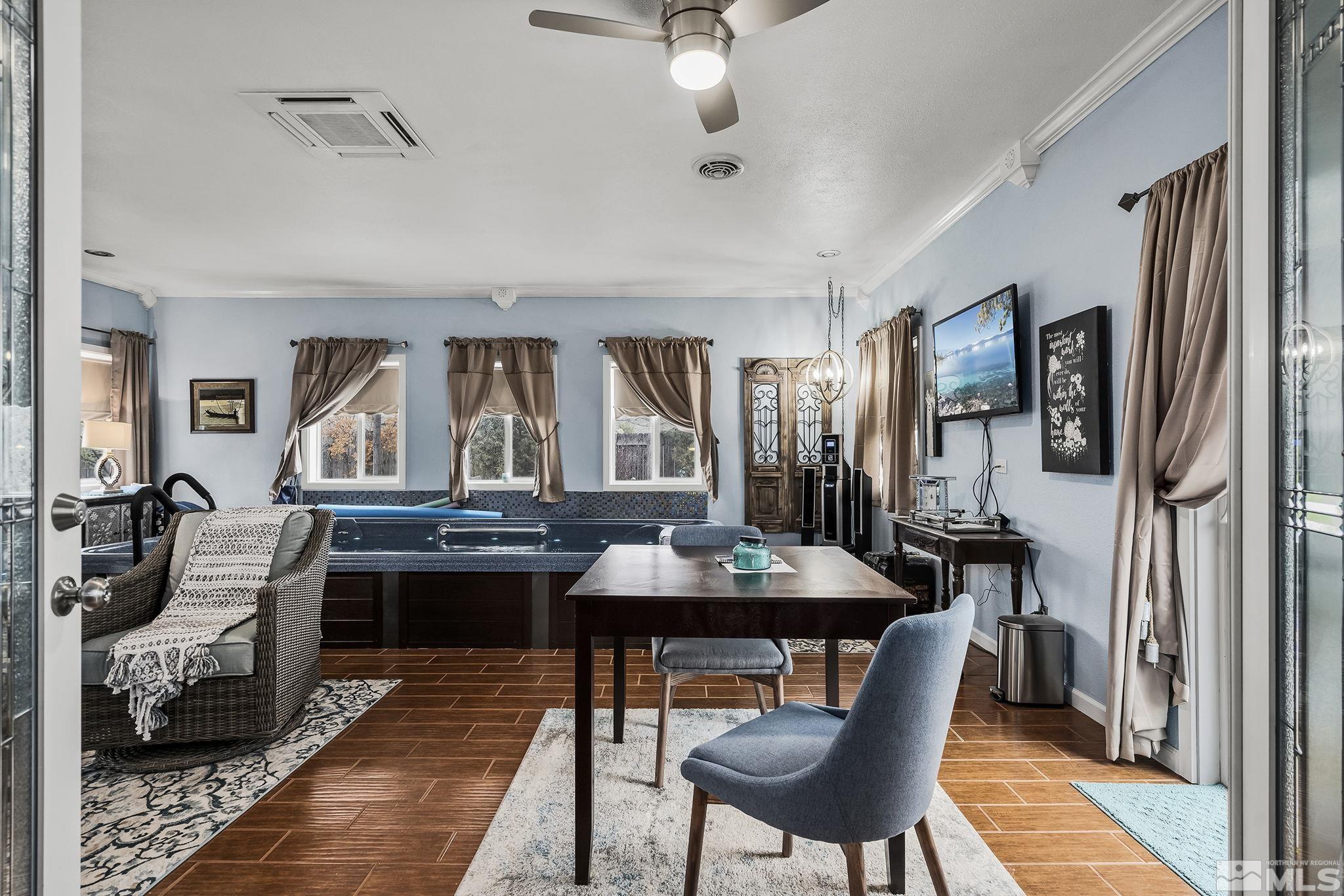 7615 Crest Bluff Drive Reno, NV 89506 - Photo 16 of 32 a view of a a dining room with furniture window and wooden floor