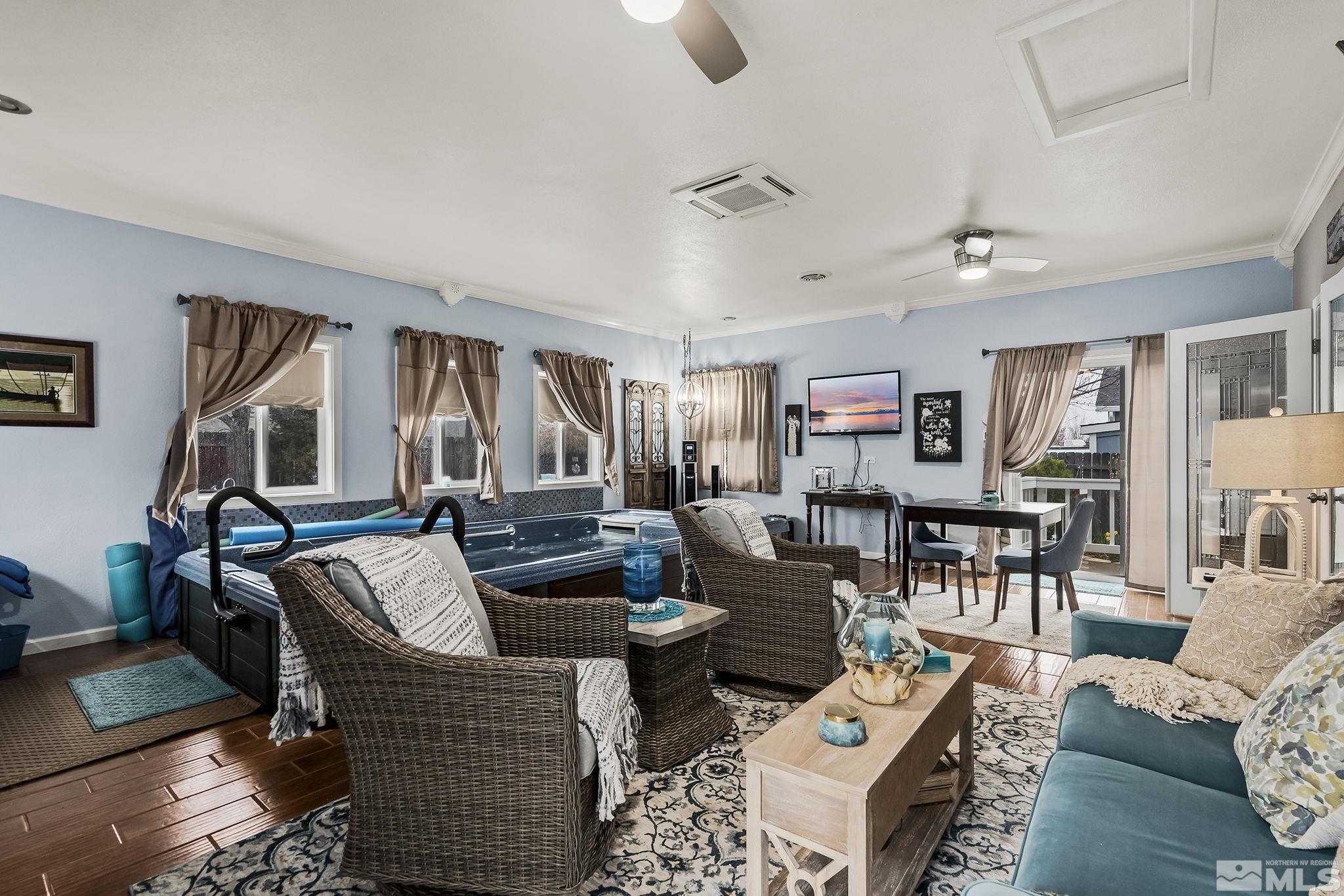 7615 Crest Bluff Drive Reno, NV 89506 - Photo 19 of 32 a living room with furniture and a wooden floor