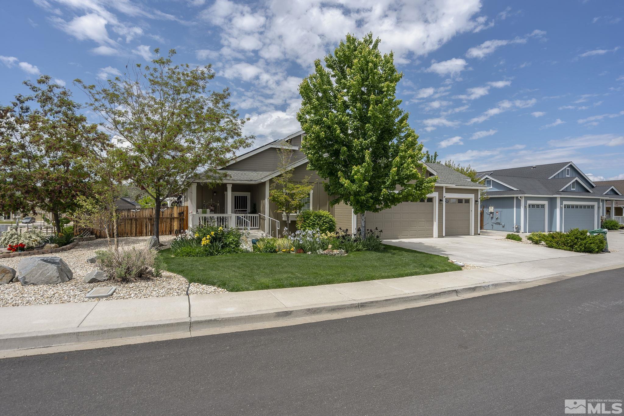 7615 Crest Bluff Drive Reno, NV 89506 - Photo 2 of 32 a front view of house with yard and green space