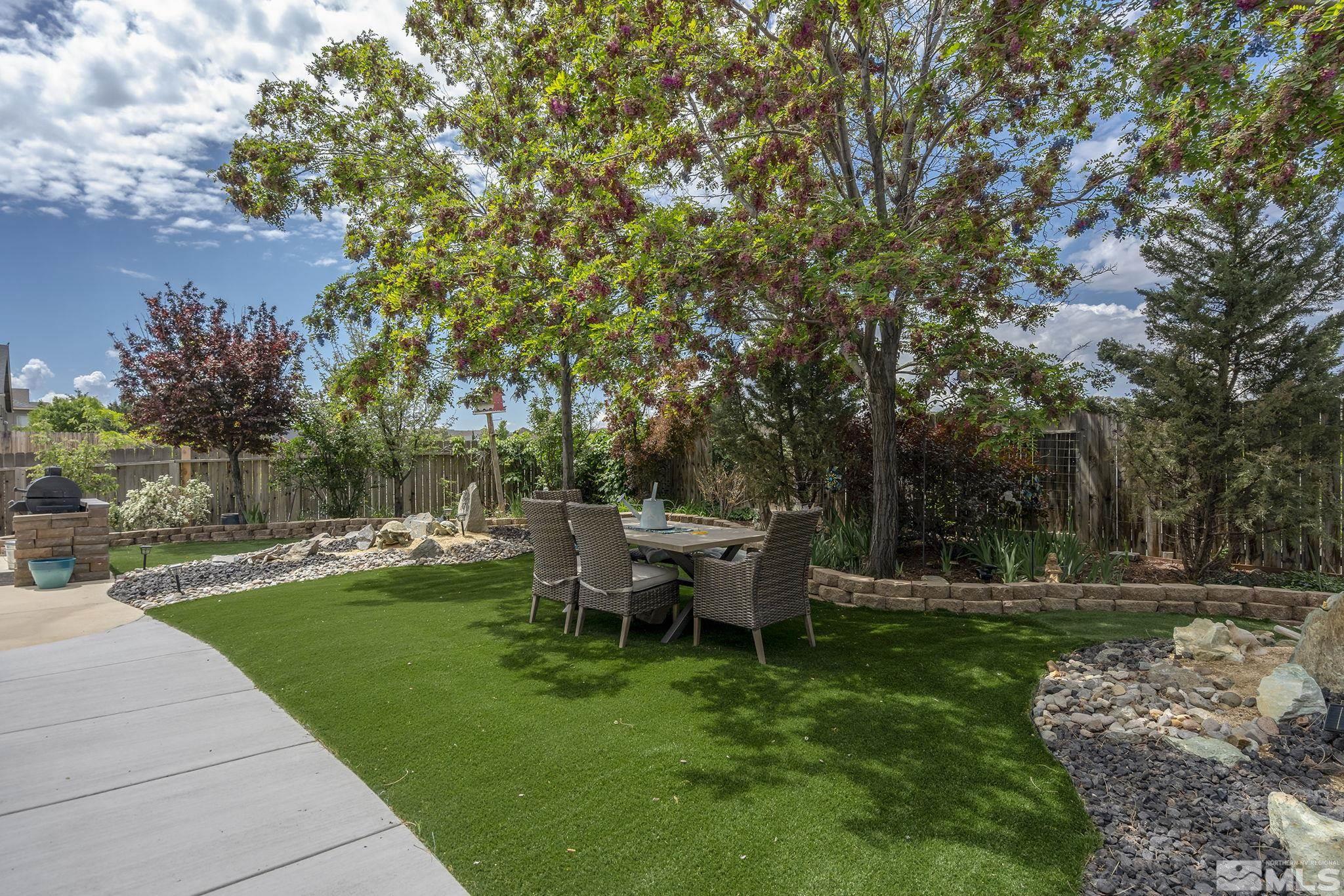 7615 Crest Bluff Drive Reno, NV 89506 - Photo 28 of 32 a view of a backyard with sitting area
