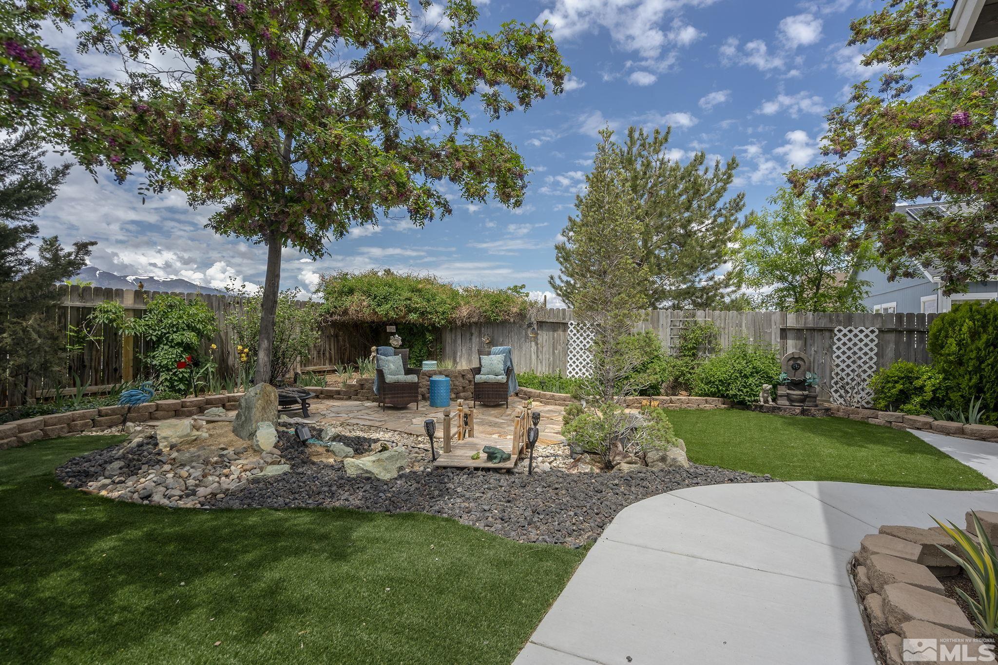7615 Crest Bluff Drive Reno, NV 89506 - Photo 29 of 32 a view of a backyard with sitting area