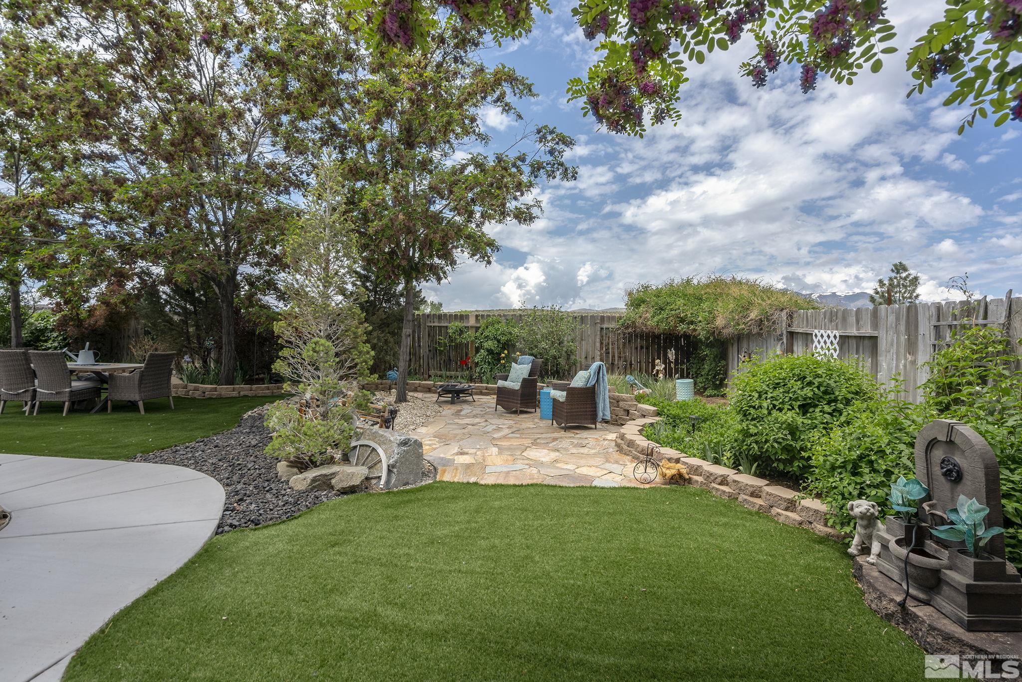 7615 Crest Bluff Drive Reno, NV 89506 - Photo 30 of 32 a view of an house with backyard space and garden