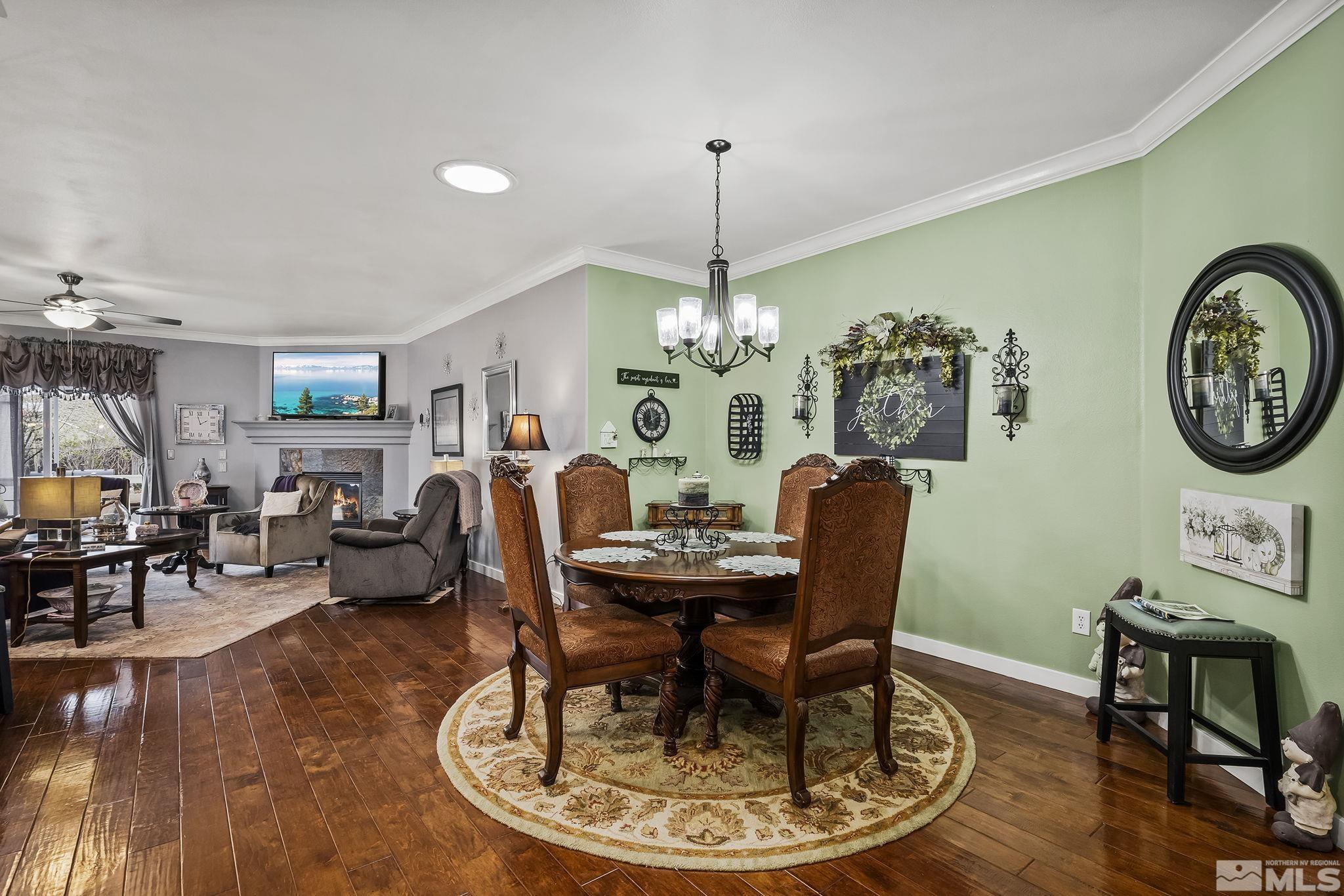 7615 Crest Bluff Drive Reno, NV 89506 - Photo 3 of 32 a view of a dining room with furniture window and wooden floor