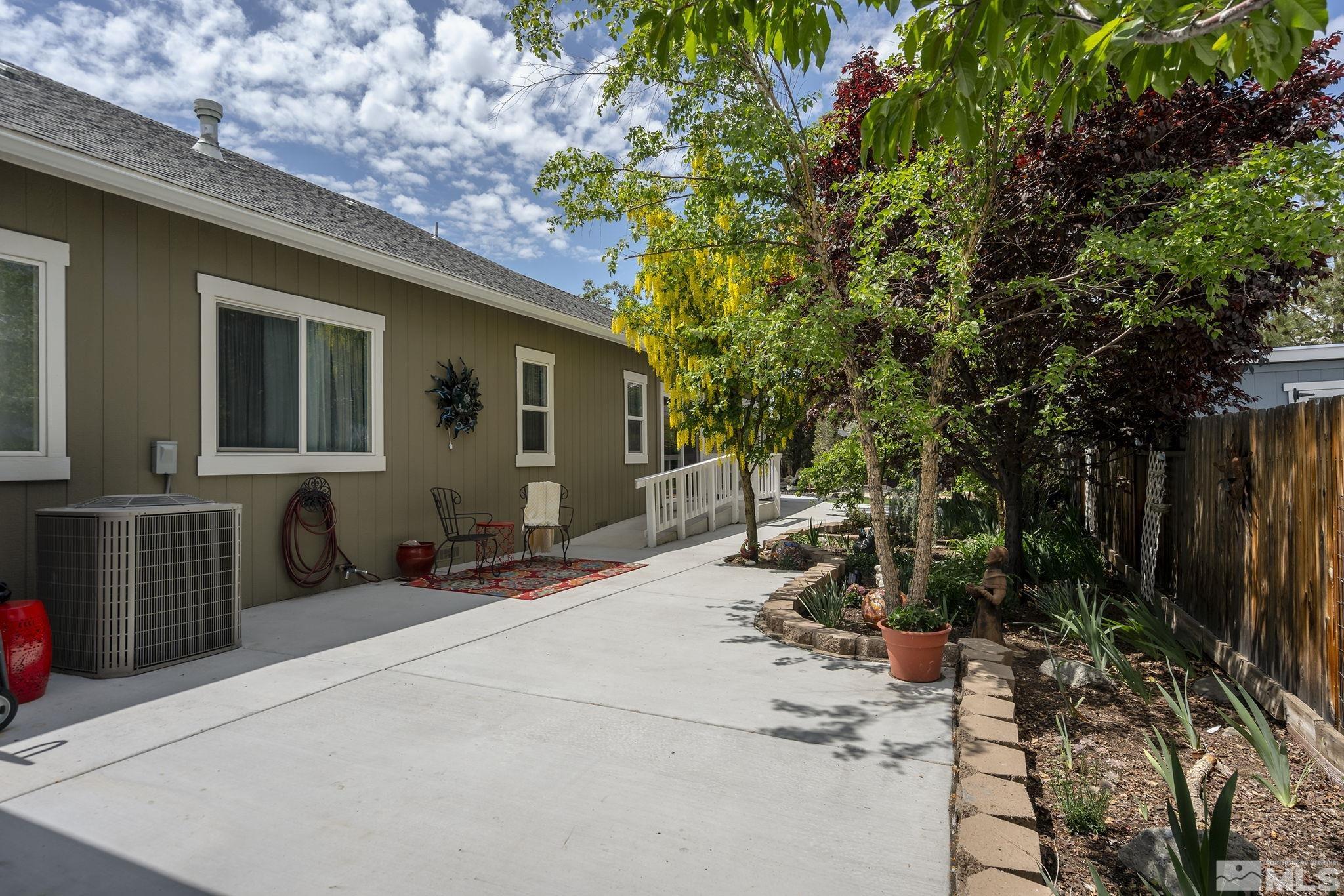 7615 Crest Bluff Drive Reno, NV 89506 - Photo 32 of 32 a view of a house with backyard and sitting area