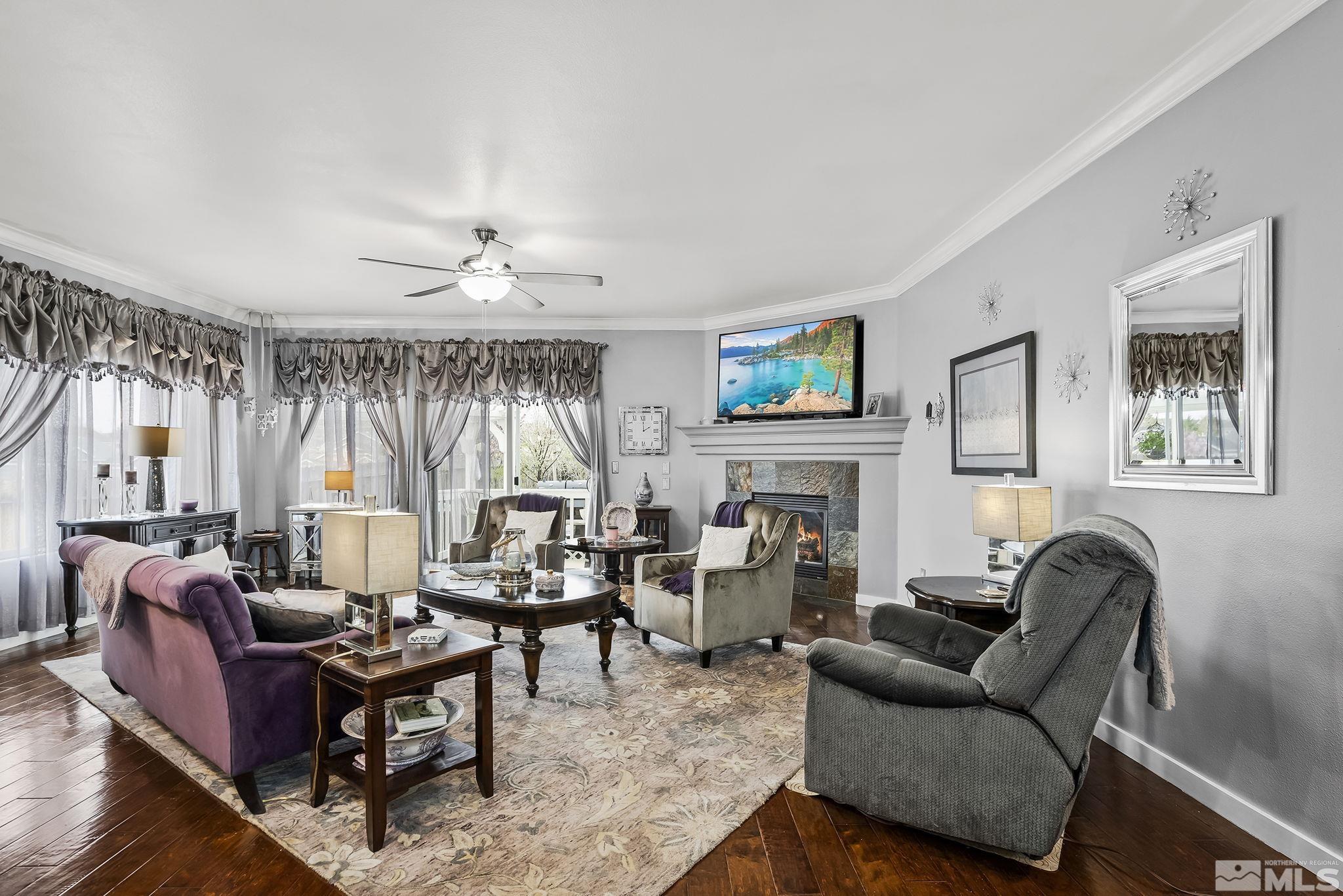 7615 Crest Bluff Drive Reno, NV 89506 - Photo 4 of 32 a living room with furniture and a large window