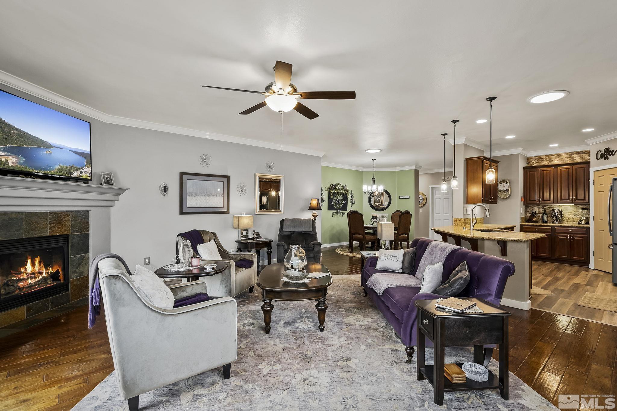 7615 Crest Bluff Drive Reno, NV 89506 - Photo 6 of 32 a living room with furniture and a fireplace