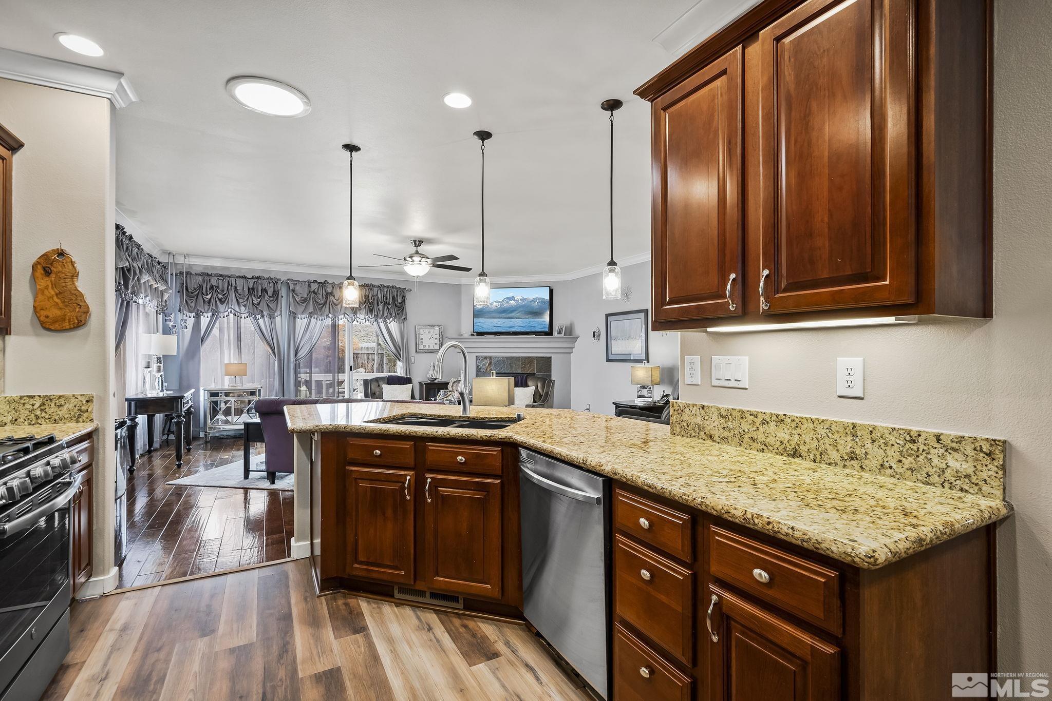 7615 Crest Bluff Drive Reno, NV 89506 - Photo 9 of 32 a kitchen with a sink and cabinets