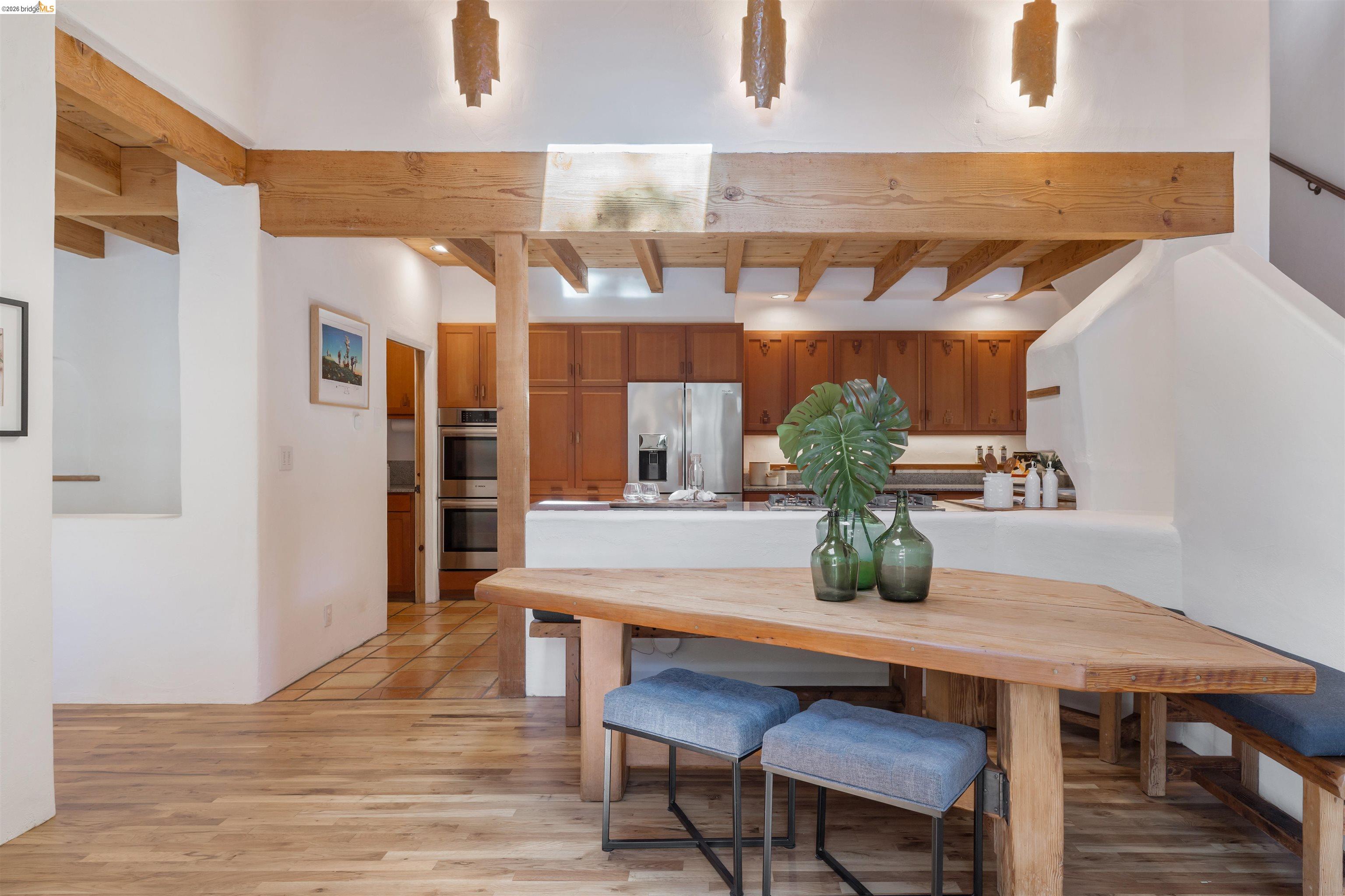 1102 Grand View Drive Berkeley, CA 94705 - Photo 18 of 50 a dining room with furniture and wooden floor