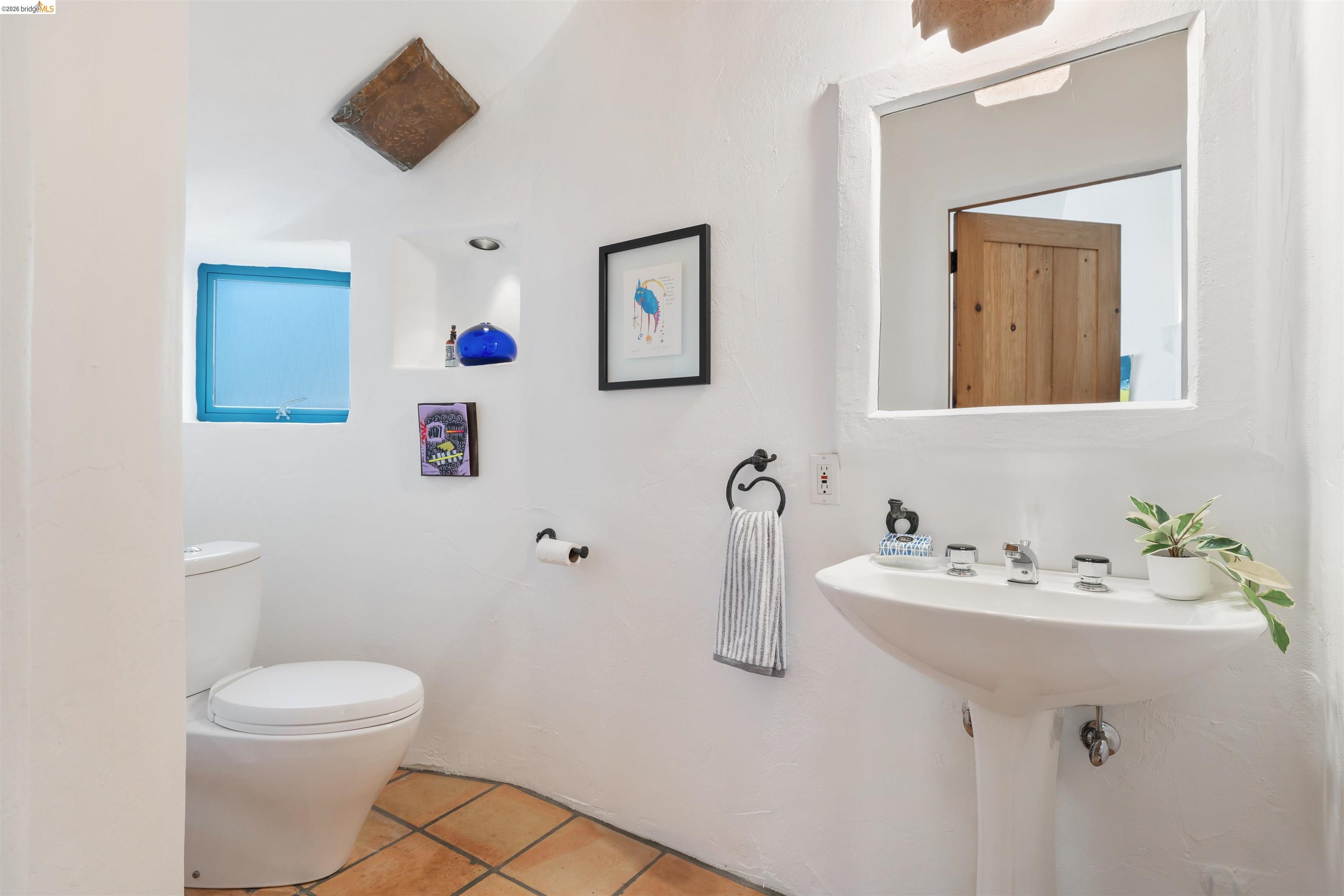 1102 Grand View Drive Berkeley, CA 94705 - Photo 23 of 50 a bathroom with a sink mirror and toilet