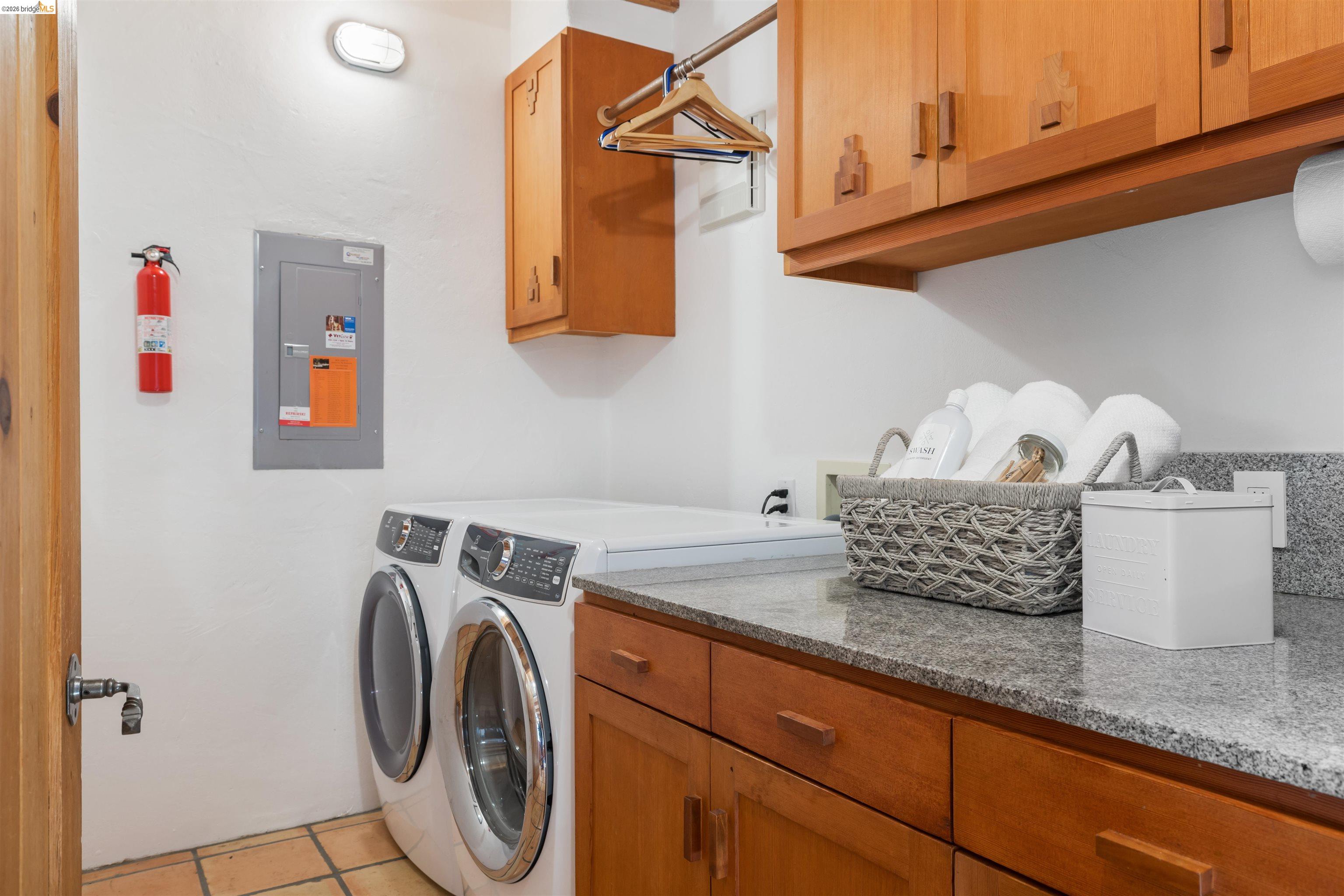 1102 Grand View Drive Berkeley, CA 94705 - Photo 24 of 50 a utility room with dryer and washer