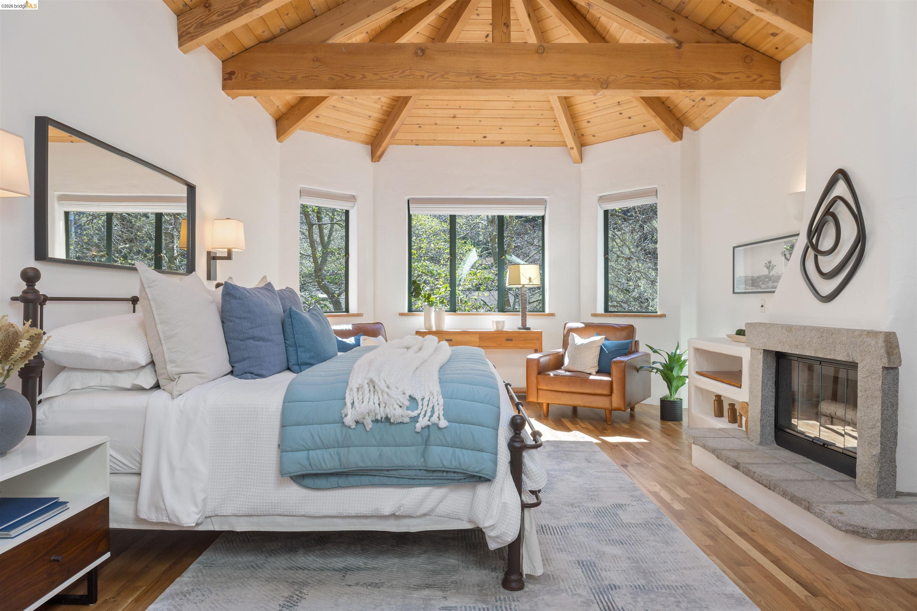 1102 Grand View Drive Berkeley, CA 94705 - Photo 26 of 50 a living room with furniture a fireplace and a floor to ceiling window
