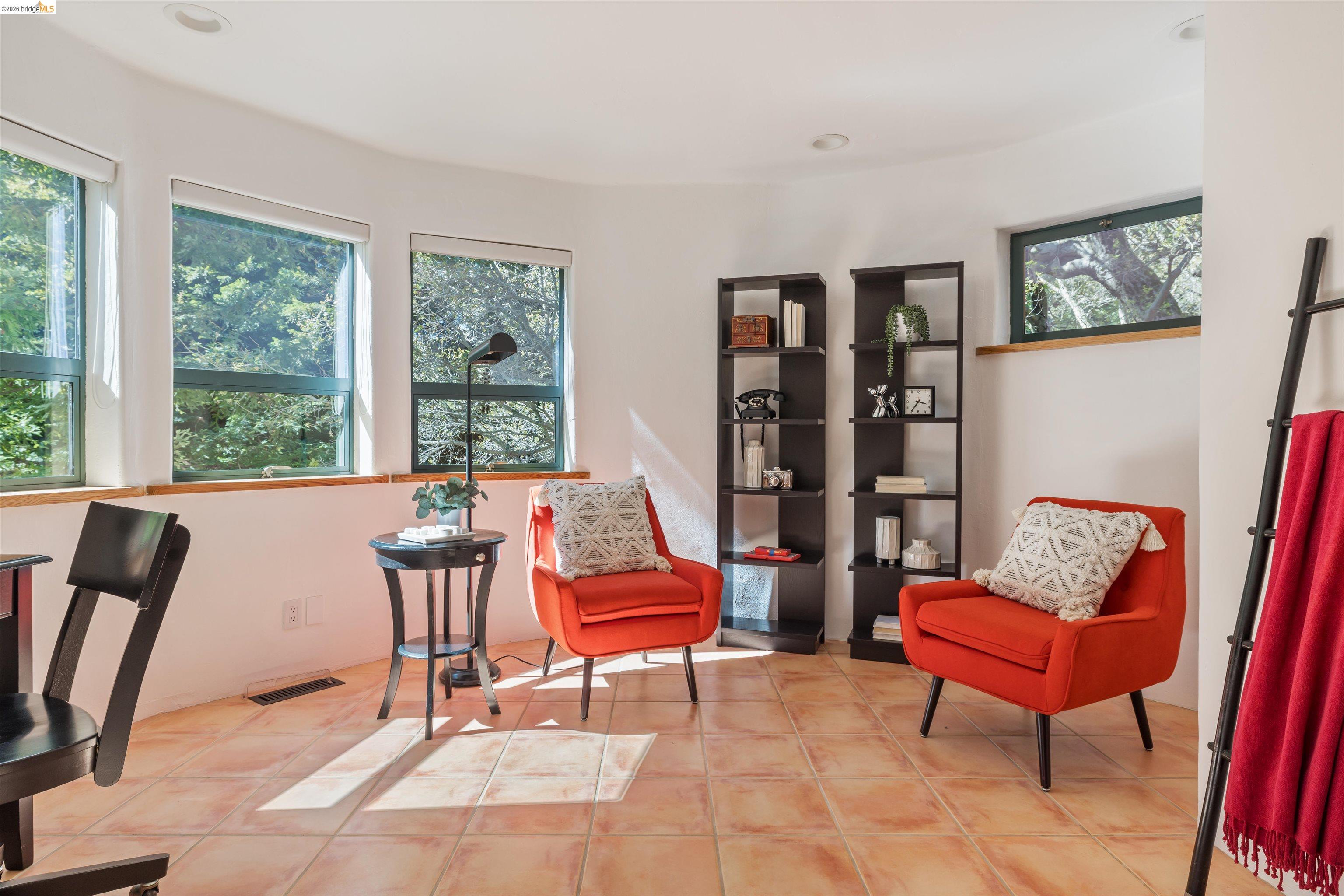 1102 Grand View Drive Berkeley, CA 94705 - Photo 36 of 50 a living room with furniture and a window