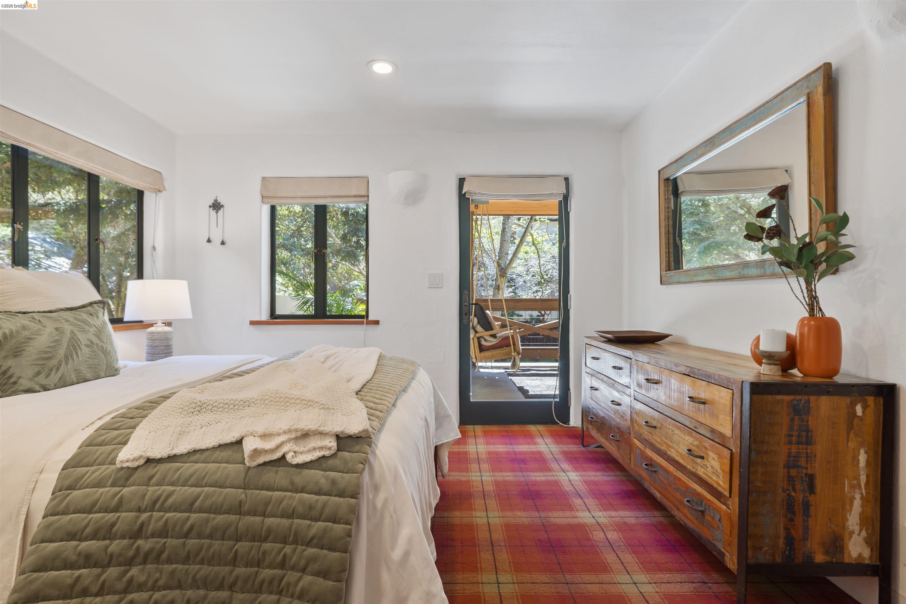 1102 Grand View Drive Berkeley, CA 94705 - Photo 38 of 50 a bedroom with a bed and a dresser in it