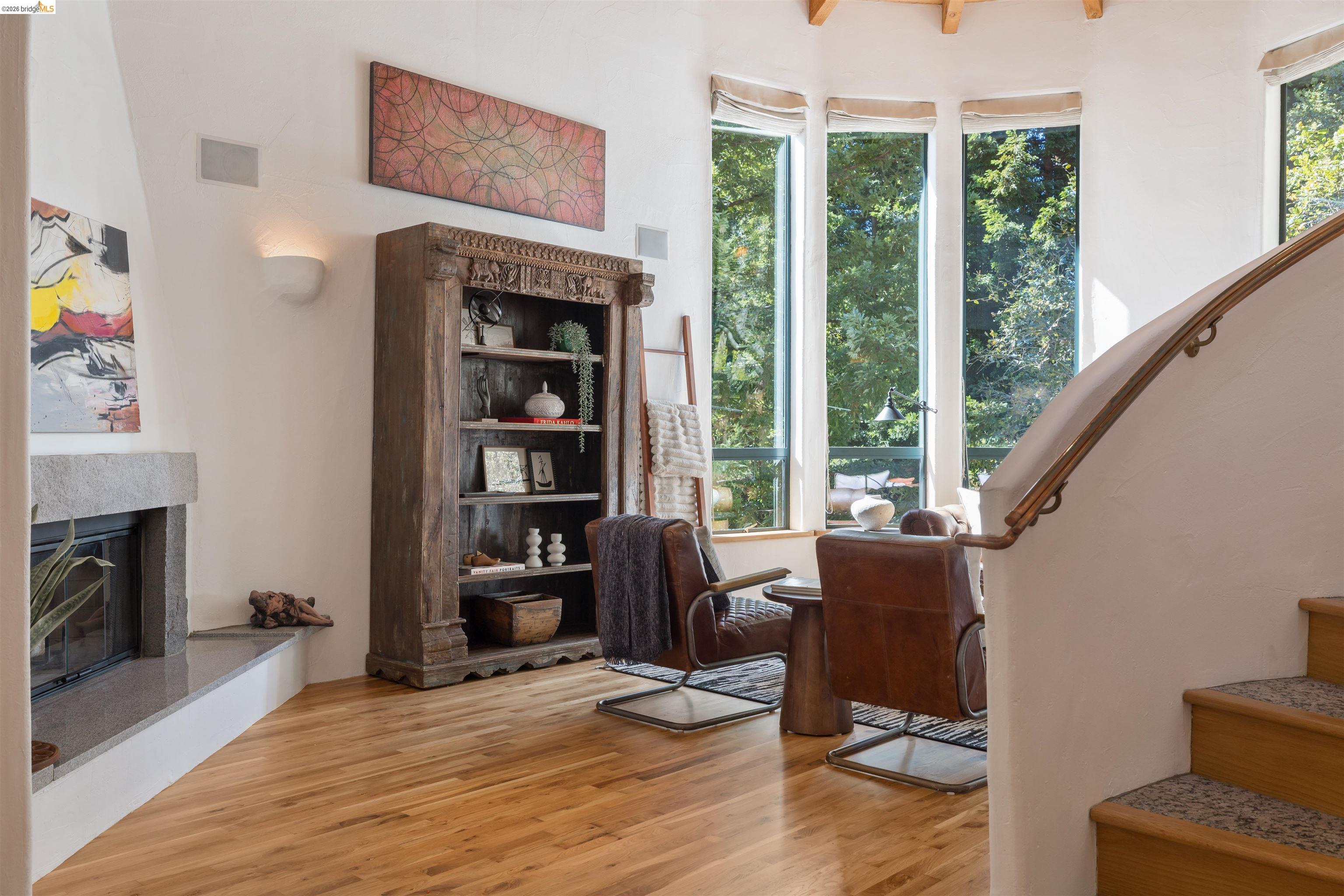 1102 Grand View Drive Berkeley, CA 94705 - Photo 5 of 50 a view of livingroom with furniture window and wooden floor