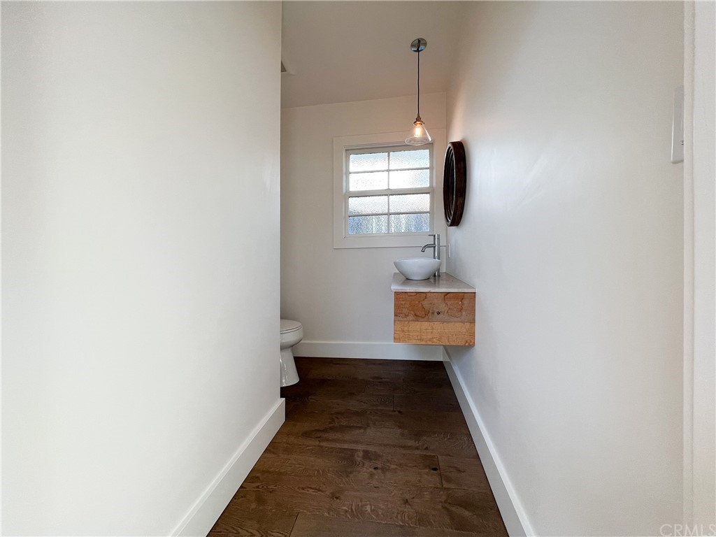 1921 Mariners Drive Newport Beach, CA 92660 - Photo 10 of 17 a view of a hallway with wooden floor and a window