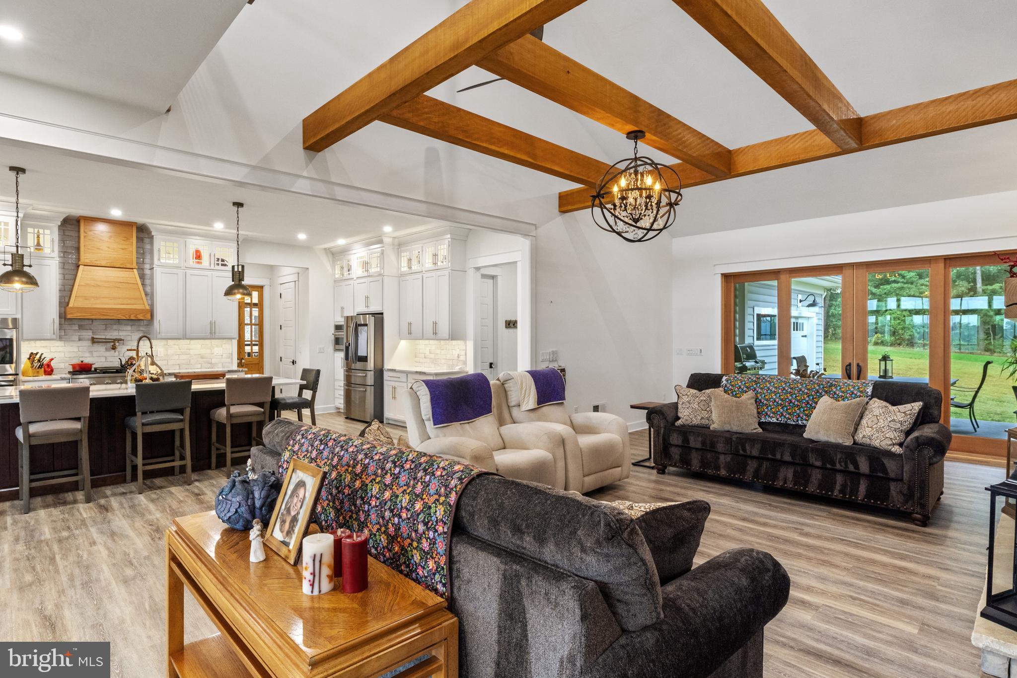 4073 Landis Road Hanover, PA 17331 - Photo 16 of 100 a living room with furniture dining table a fireplace and a large window