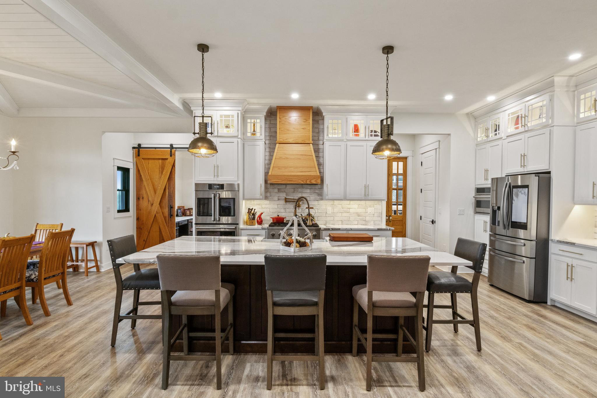 4073 Landis Road Hanover, PA 17331 - Photo 17 of 100 a dining room with stainless steel appliances kitchen island granite countertop a dining table chairs and a refrigerator