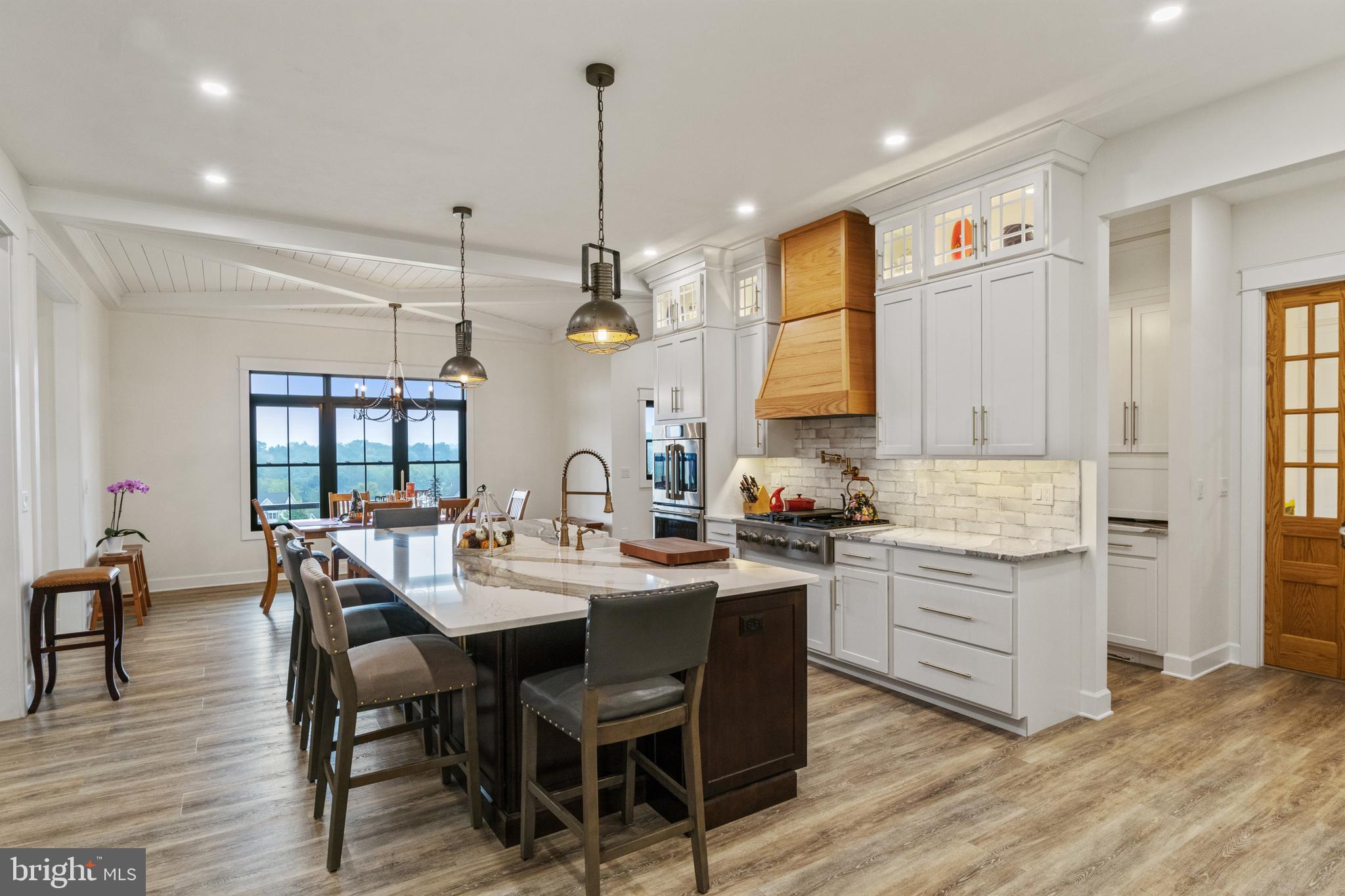4073 Landis Road Hanover, PA 17331 - Photo 19 of 100 a view of a dining room and livingroom with furniture wooden floor a chandelier